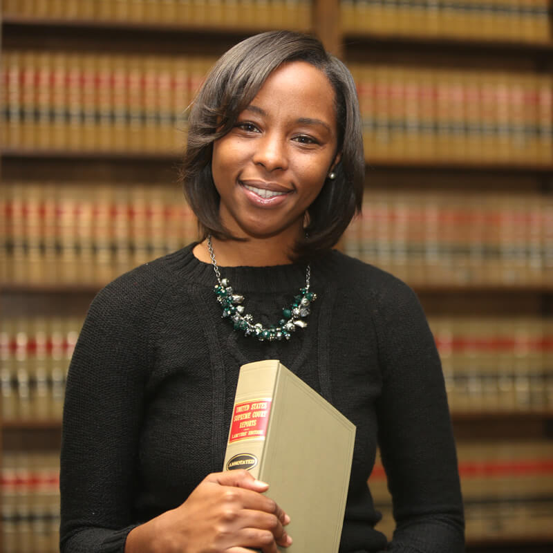A young lawyer in a law library.