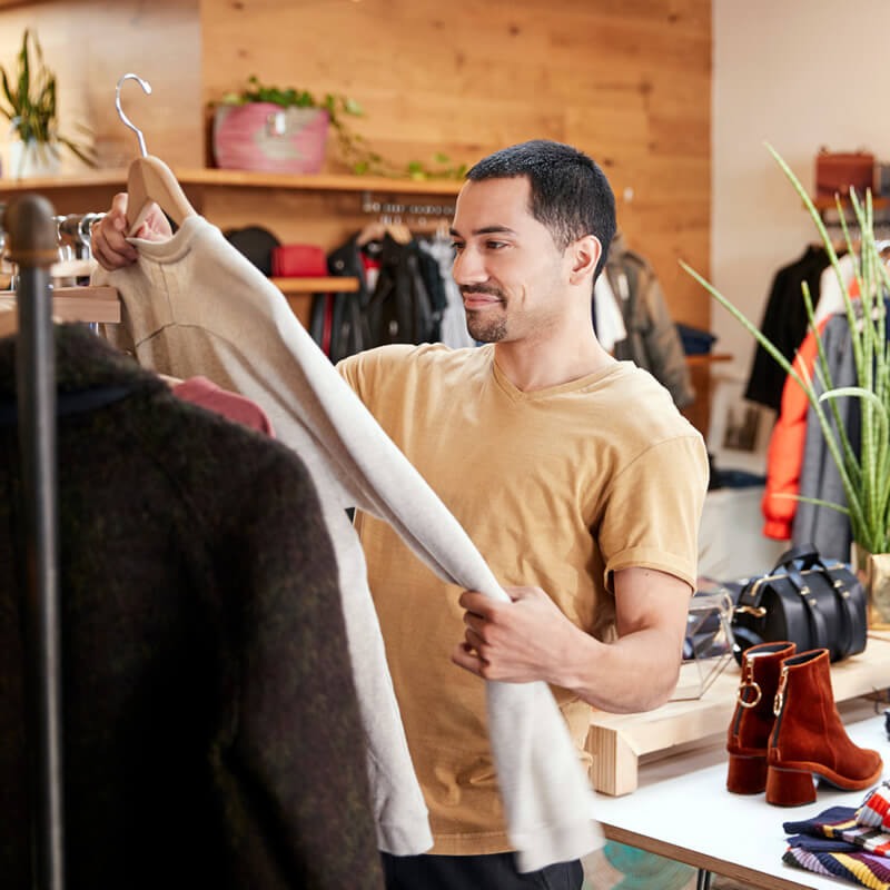 A man shopping for a new shirt.