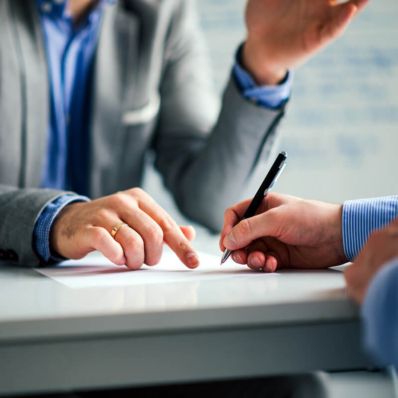 A man signs a legal document.