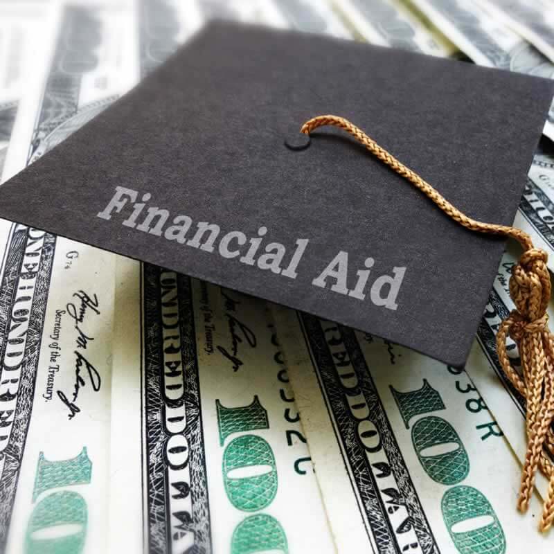 A college cap with the words financial aid written on it.