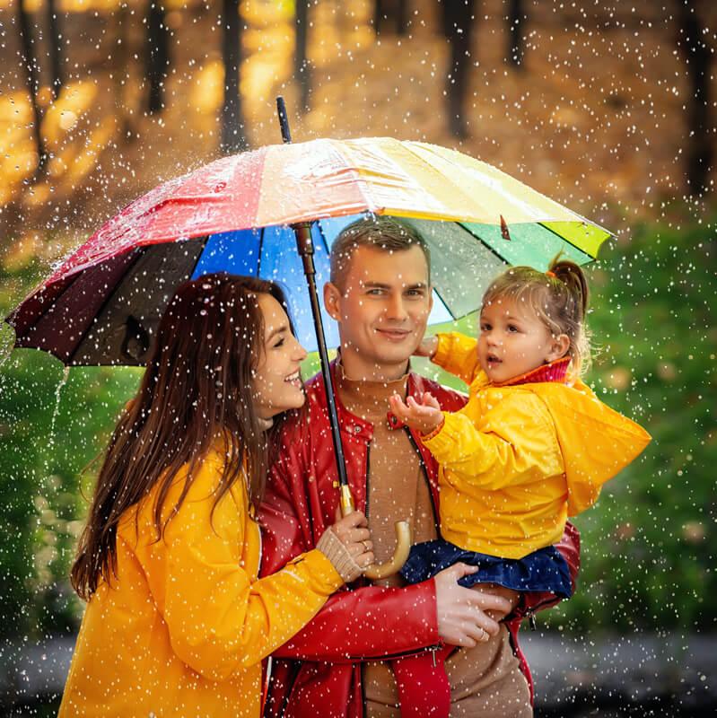A young family in the rain
