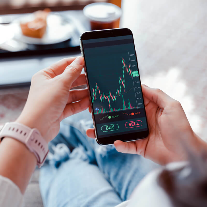 A stock market chart shown on a cell phone screen