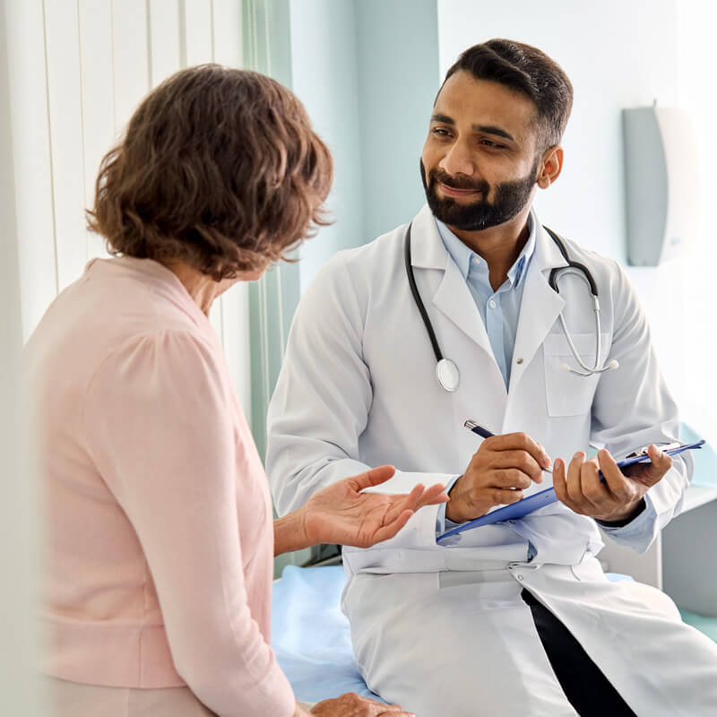 A woman visiting a doctor.