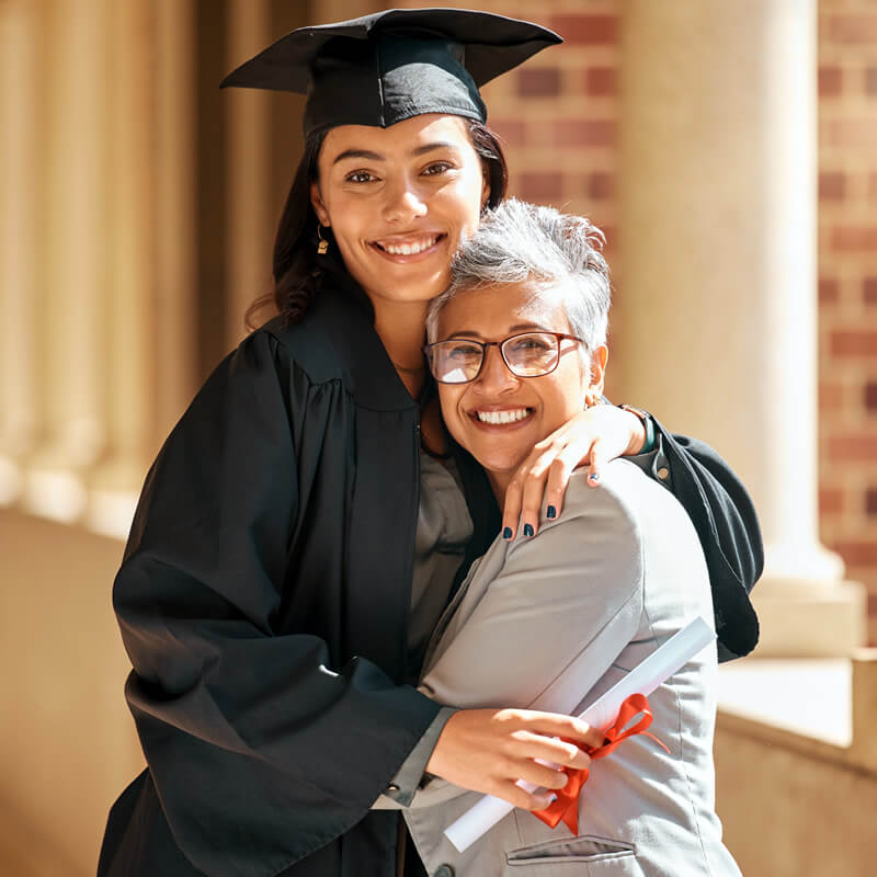 A new college graduate with her mother.