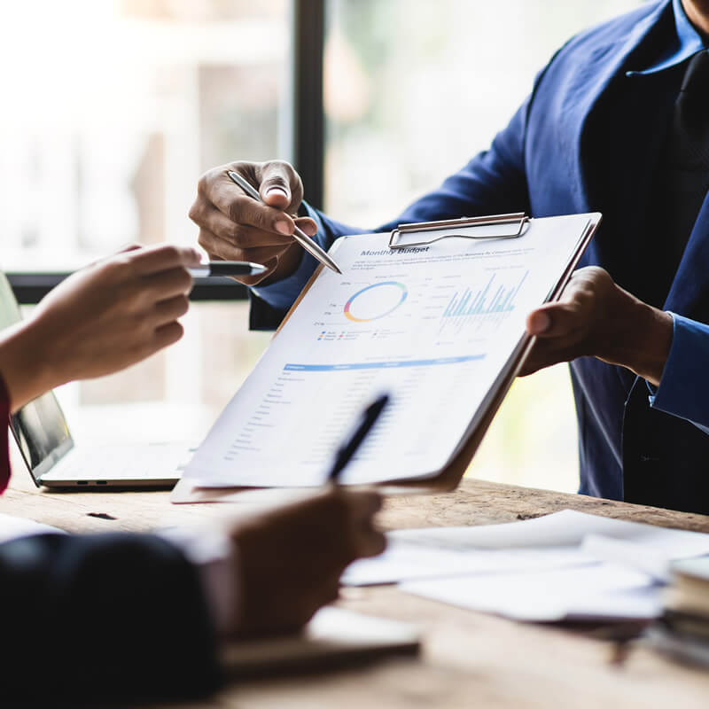 A financial professional shares figures with his client.