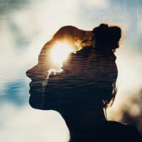 A conceptual image of a woman the overlaps with a sun in the clouds.