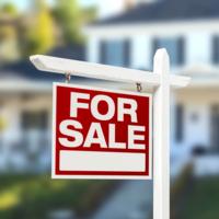 A home for sale sign.