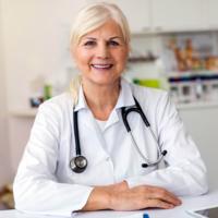 A doctor smiles at you