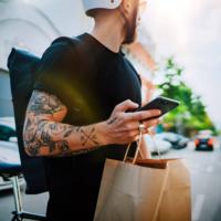 A delivery man making a food delivery.