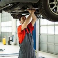 A mechanic working on a car.