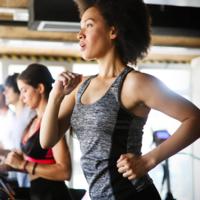 A woman exercising on a treadmill.