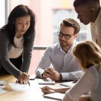 A team of workers collaborate to solve a problem.