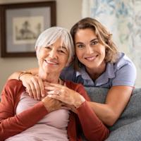 A smiling mother and daughter