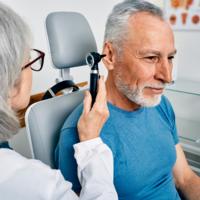 A doctor examines a patient