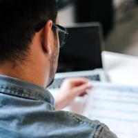 A man reviews a financial statement.