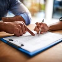 A person signs a contract