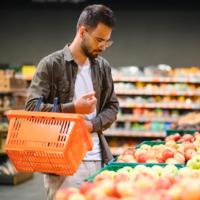 A man shops at the supermarket.