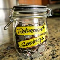 A jar of money representing saving for retirement.