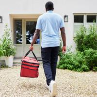 A delivery driver makes a delivery.